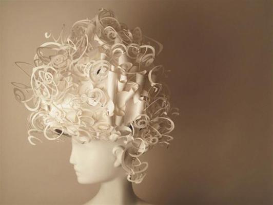 The wigs mimic real hairstyles, and are constructed solely with paper.