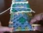 Join crocheted granny squares using a five chain flat braid method