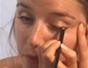 Create a shiny eye makeup look over a natural face