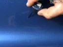 Touch up the paint on a car and fill in any missing spots