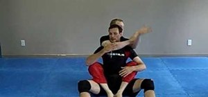 Escape a rear choke from the ground with Jiu Jitsu