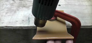 Bend acrylics (like Plexiglas) with a hot air gun