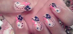 Paint your nails with an elegant dot and flower design