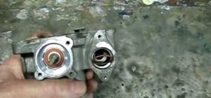 Remove and clean the throttle body in a Saturn car
