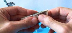 Fold a tiny origami giraffe from a dollar bill