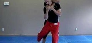 Escape from a standing rear choke using Jiu Jitsu