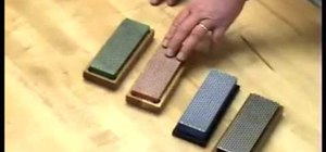Sharpen a kitchen knife with a sharpening steel