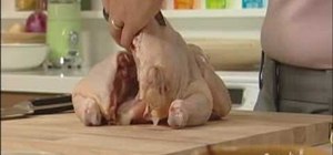 Cut up a whole chicken with a chef's knife