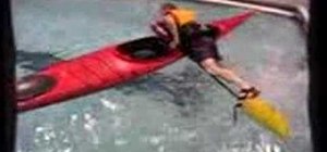 Paddle float self-rescue in a sea kayak