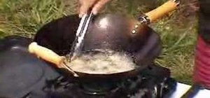 Deep fry crumbed snapper in a wok