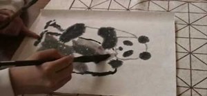 Draw a panda bear with a Chinese painting brush