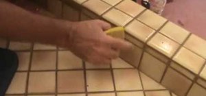 Remove and clean grout from a tile patch area