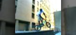 Perform a 360 ledge on a BMX bicycle