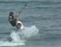 Do a back roll while kiteboarding