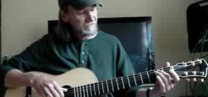 Play a Travis-style E blues progression on guitar