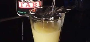 Pour Absinthe in the Czech style using fire