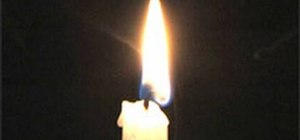 Relight a candle by igniting the smoke with a flame