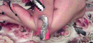 Paint nails with a pink, silver and black art theme