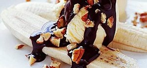 Make a banana split with dark chocolate and peanuts