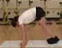 Do an advanced slide board pike ab exercise