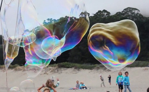 Giant Beach Bubbles Resemble Ghostly Whales
