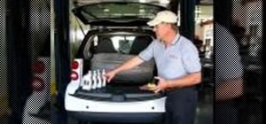 Change the oil to a Smart car using a topside changer