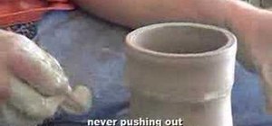 Throw a tall cylinder on a pottery wheel