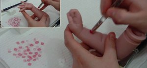 Mottle with a berry maker brush on a reborn baby doll