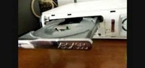 Open an Xbox 360 tray with a paperclip