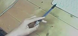 Do the "Backaround Harmonic" pen spinning trick