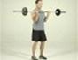 Tone arms with a standing barbell curl exercise