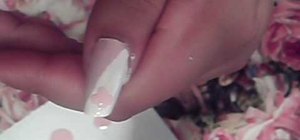 Paint nails in a sparkly pink and white silver design