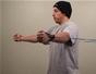 Do a pec fly exercise with resistance tubing