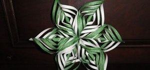 Craft an intricate lacy paper snowflake decoration for Christmas