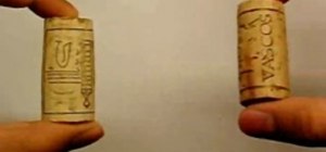 Perform a bar trick with two corks.