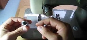 Thread a bobbin on a side threading sewing machine