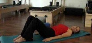Warm up for pilates with a pelvic curl exercise