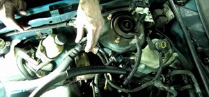 Replace a cylinder head on a Ford Escort automobile