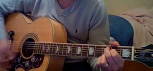 Play "Love Me Do" by The Beatles on guitar