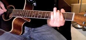 Play "Day Tripper" by the Beatles on acoustic guitar
