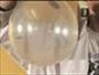 Make a coin spin inside a balloon