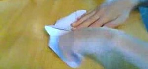 Create a paper airplane using scissors
