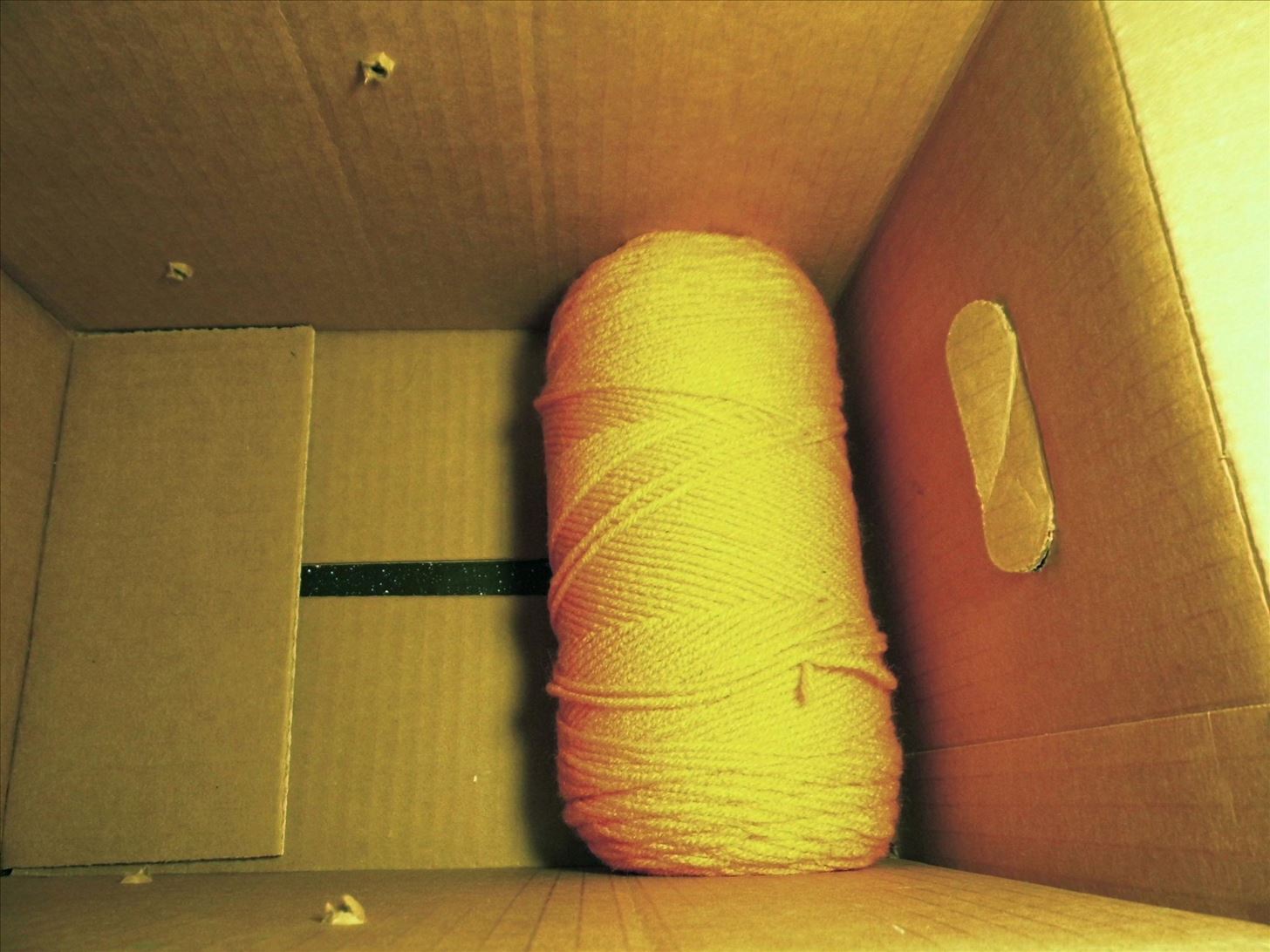 How to Make a Yarn Dispensing Display Out of a Cardboard Box and Dowels