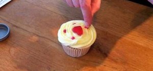Decorate Valentine's Day cupcakes with vanilla buttercream frosting
