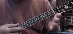 Play a B flat chord on the ukulele