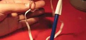 Make a pen vanish using a rubber band