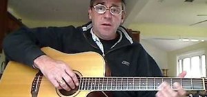 Play "Harvest Moon" by Neil Young on acoustic guitar