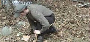 Do a bow drill friction-fire method to start a fire