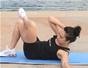 Do an elbow to knee side crunch ab exercise