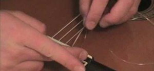 Change the nylon strings on a classical guitar